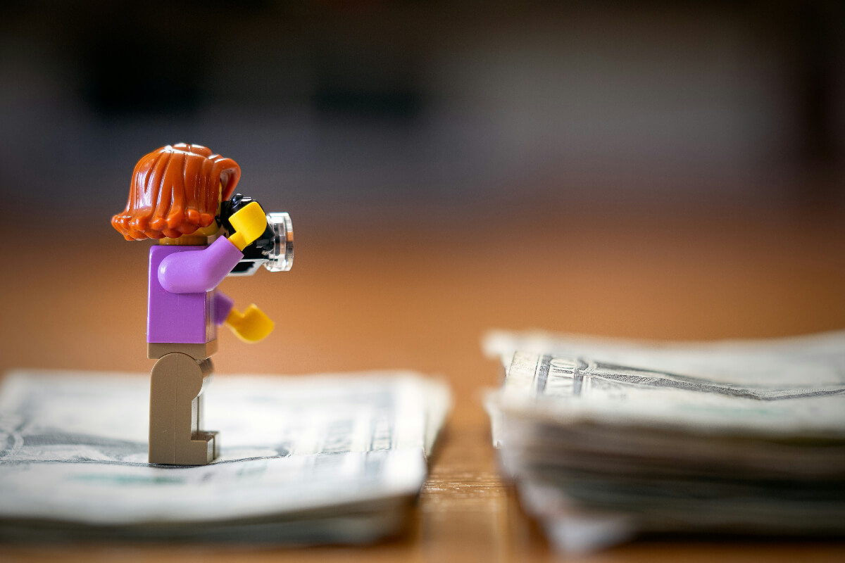 A collection of LEGO sets and loose bricks spread out on a table
