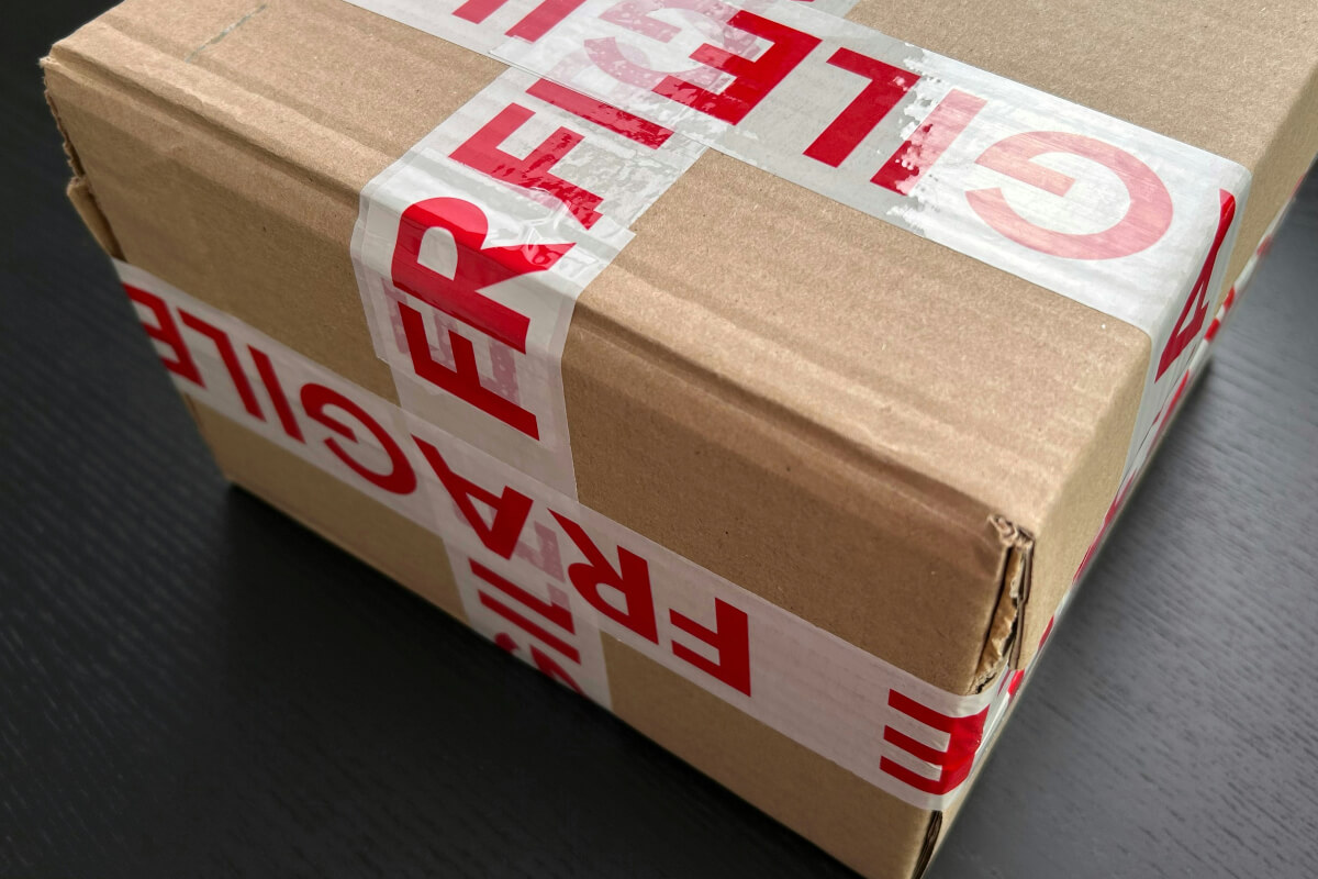 A securely taped cardboard box ready to be posted